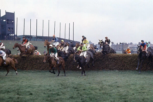 Grand National Horserace held at Aintree, Liverpool. Action at one of the jumps
