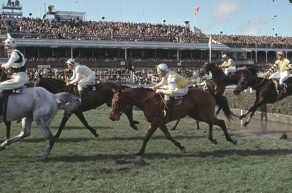 Grand National Horserace held at Aintree, Liverpool. Action at the water jump