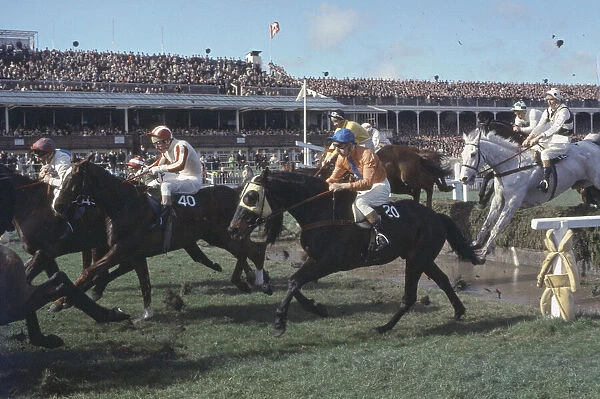 Grand National Horserace held at Aintree, Liverpool. Action at the water jump