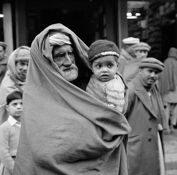 A grandfather and his grandson seen here on the streets of Peshawar the capital of