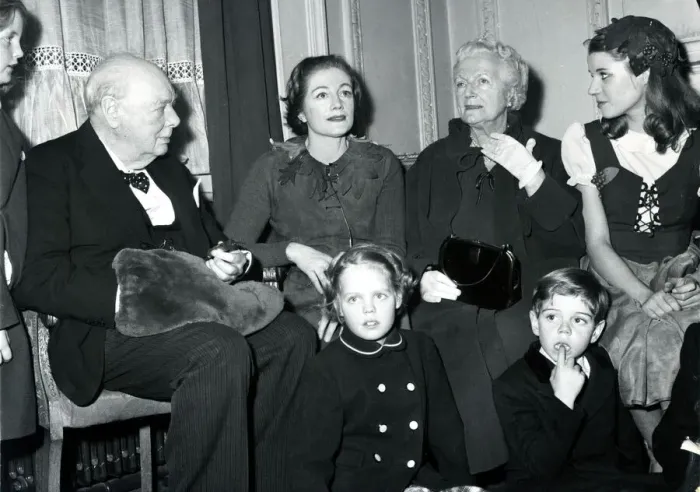Framed Print : Grandpa Sir Winston-hand in muff-presides over a family group at London Framed Print : Grandpa Sir Winston-hand in muff-presides over a family group at London