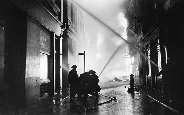 The Great Fire of London. Firemen at work on the city fire - they have a long night