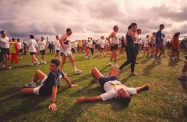 The Great North Run 14 September 1997 - runners take a well-earned rest after completing
