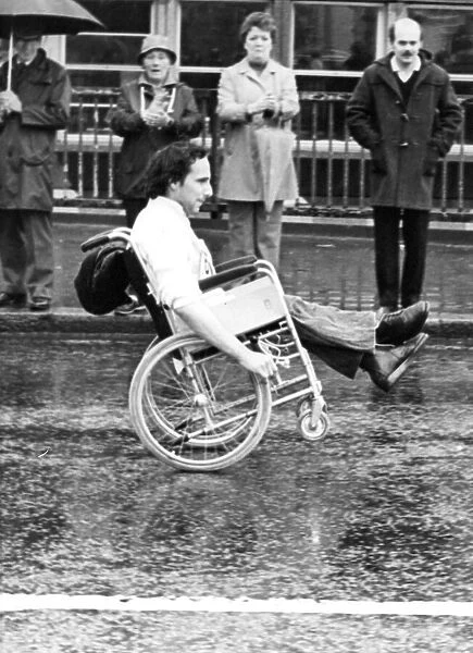 The Great North Run 27 June 1982 - A wheelchair competitor does a wheelie across the Tyne