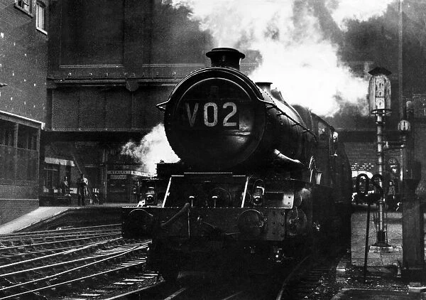 The Great Western Railway 6000 Class King George VI 4-6-0 steam locomotive 6028 pulls