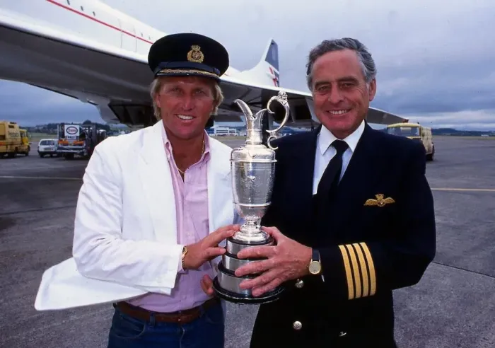 Framed Print : Greg Norman holds the Claret Jug trophy after winning the British Open with Concorde