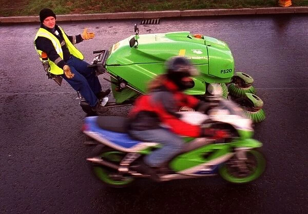 Greg Walker on green motorbike and Stuart Harden with his green machine road cleaner for