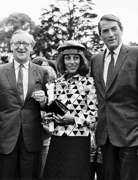 Gregory Peck actor with his french wife Veronique at a fete