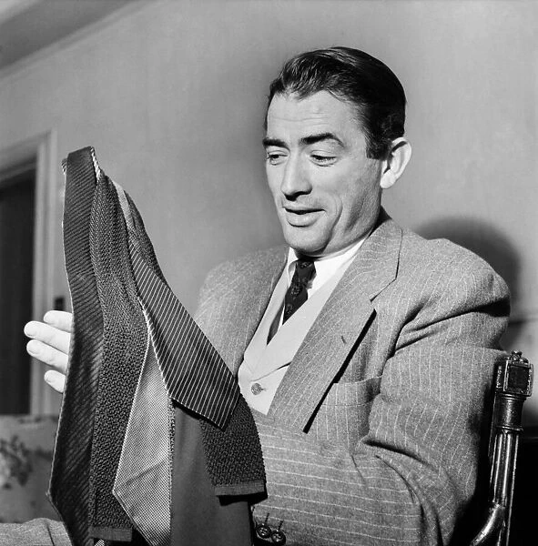 Gregory Peck and purchases from Burlington arcade. October 1952