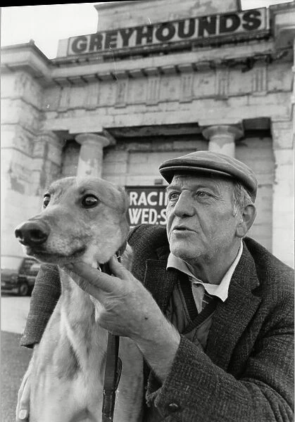 Greyhound trainer with his dog No Stranger at the last meeting at the Derby Greyhound