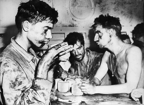 Grimy and weary after 48 hours of fighting on Eniwetok Atoll in the Marshall Islands