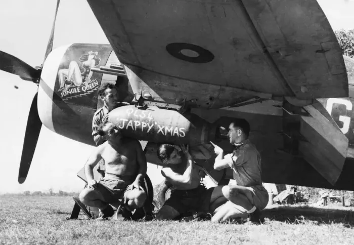 Framed Print : Four ground crew of No. 134 Squadron RAF load a 500-lb GP bomb