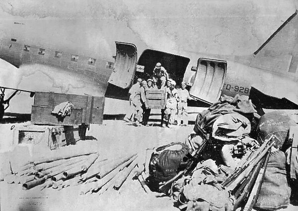 Ground forces of an American fighter squadron move their gear into an Italian airfield