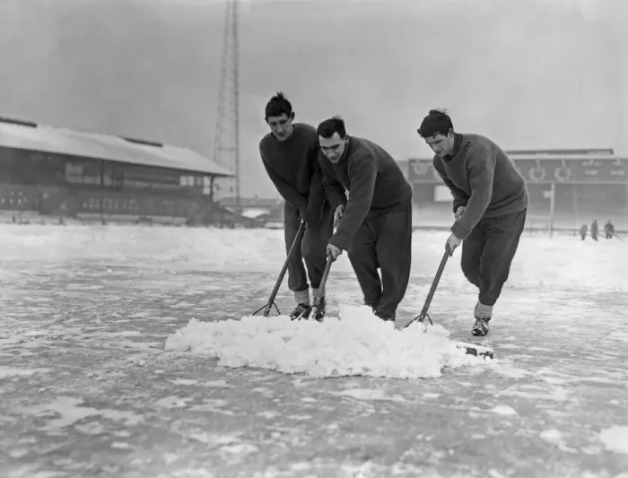 Framed Print : Grounds staff at Bristol Rovers Eastville Stadium struggle to clear snow from the pitch