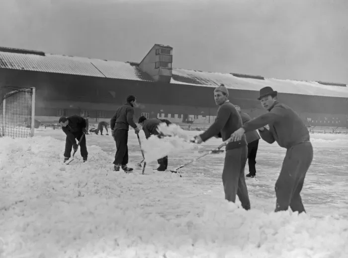 Framed Print : Grounds staff at Bristol Rovers Eastville Stadium struggle to clear snow from the pitch