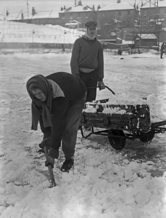 Framed Print : Grounds staff at Bristol Rovers Eastville Stadium struggle to clear snow from the pitch Framed Print : Grounds staff at Bristol Rovers Eastville Stadium struggle to clear snow from the pitch