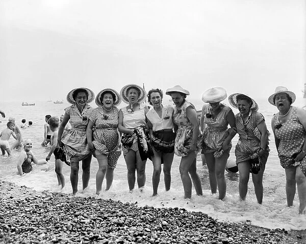 A group of elderly women go for a paddle in the cold sea at Southend, Essex