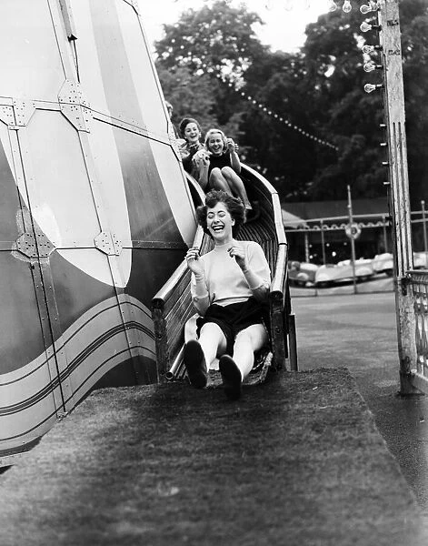 A group of friends enjoying Battersea Fun Fair, London. 14th June 1953