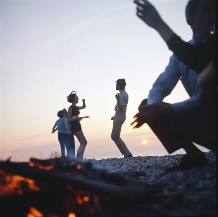 Framed Print : Group of friends enjoying themselves during a day out at the seaside in Greece