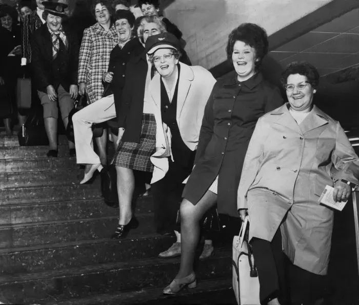 Framed Print : A group of Housewives pose for a picture before leaving Britain for a holiday in Framed Print : A group of Housewives pose for a picture before leaving Britain for a holiday in