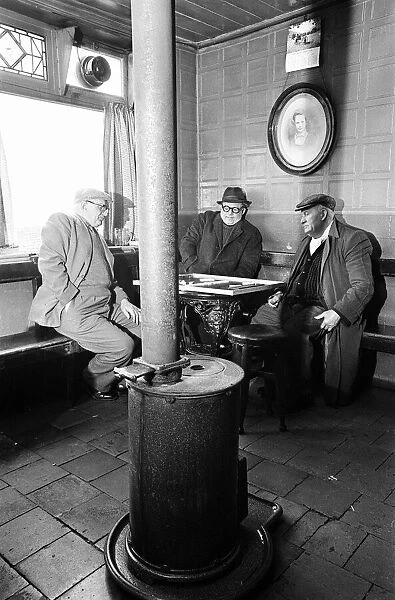 Group of men play dominoes at the Druids Head Inn in Coseley