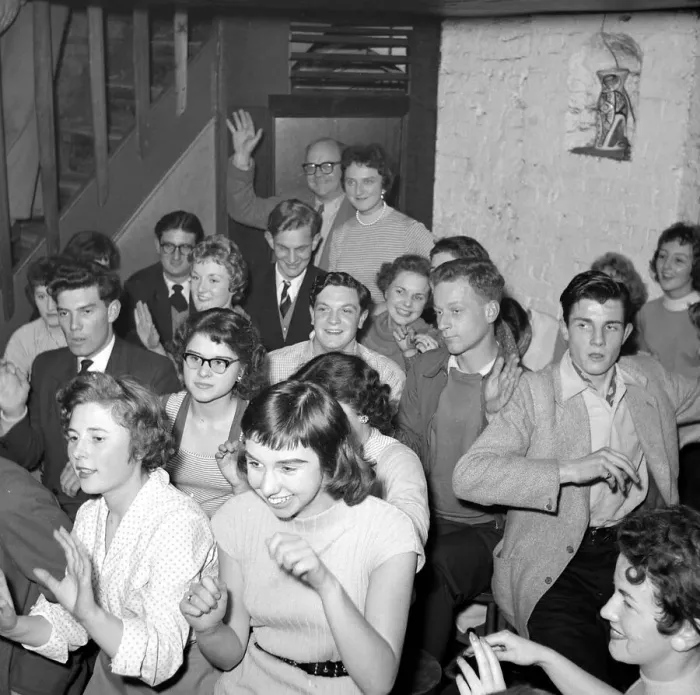 Framed Print : A group of men and women sitting down hand jiving Circa 1955 Framed Print : A group of men and women sitting down hand jiving Circa 1955