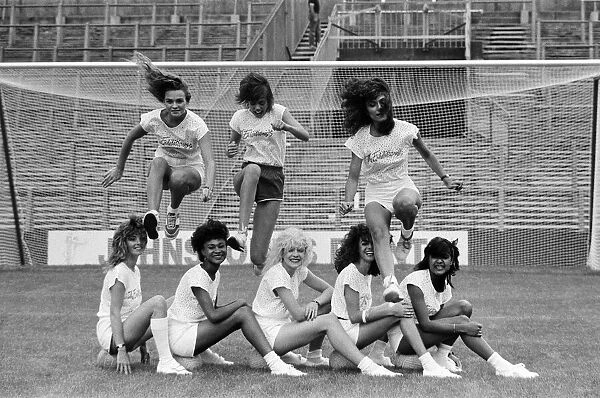 A group of model girls, known as The Exhibitionists, are training for a 5-a-side football