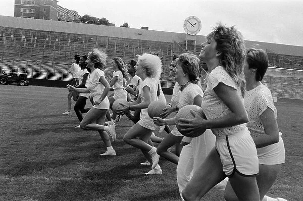 A group of model girls, known as The Exhibitionists, are training for a 5-a-side football