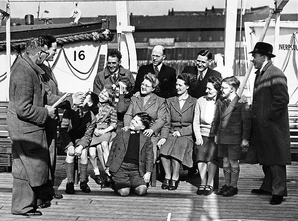 A group of people on board the liner Georgie in Liverpool docks
