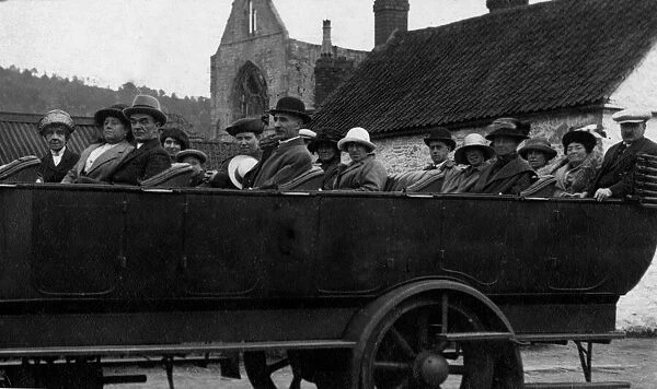 A group of people take their places on the charabanc ready for a day out