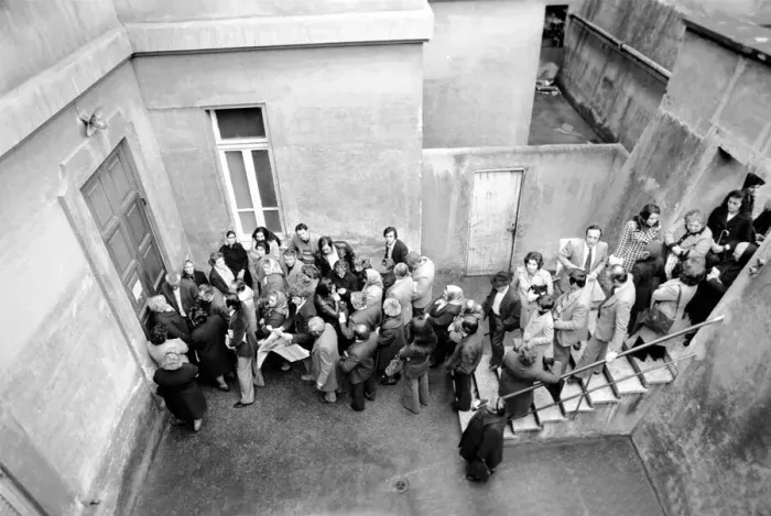 Framed Print : A group of people queuing to enter a building in a suburb on the outskirts of Rome