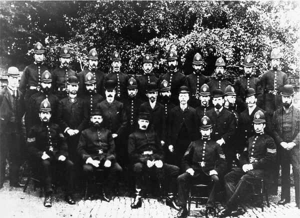A group of police officers pose for the camera
