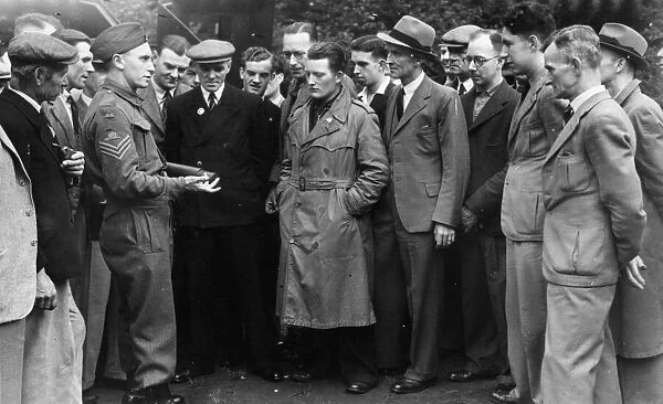 A group of recruits for the Reading Home Guard Ant-Aircraft Battery receive instructions