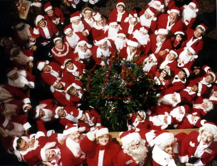Framed Print : A group of Santas pose at a Christmas party. 19th December 1991