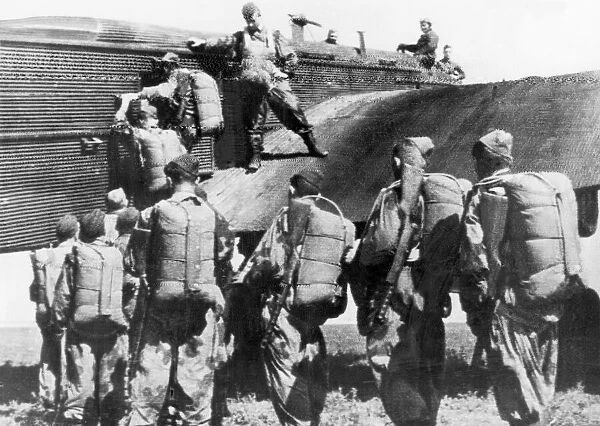 A group of Soviet parachutists boarding a plane during drills before joining guerillas