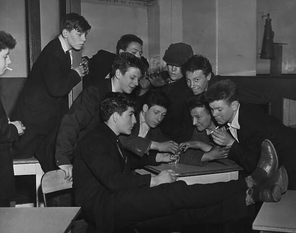 A group of Teddy Boys smoking cigarettes at the Rodney Youth Centre in Liverpool