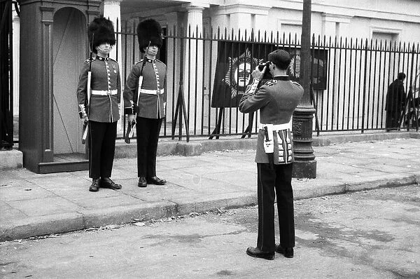Guardsmen have a snapshot of themselves at the Wellington Barracks