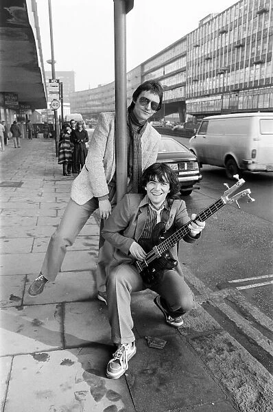 Guitarist Gerry Cott (standing) and bass player Peter Briquette from the Boomtown Rats
