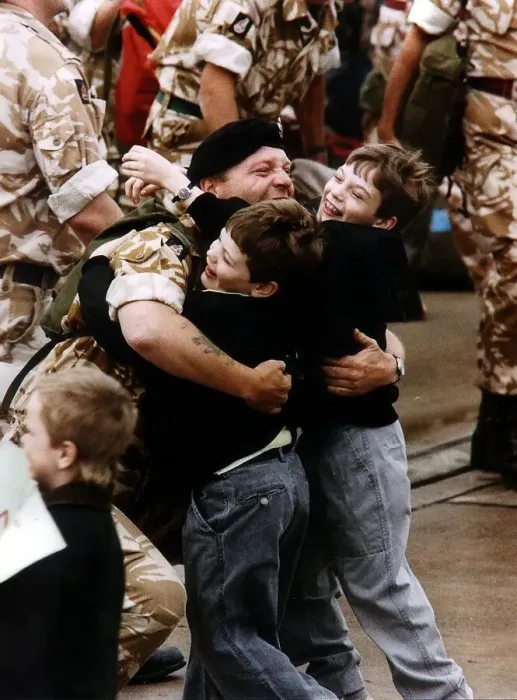 Framed Print : Gulf War reunion A soldier is met by his two children returning from Gulf War Framed Print : Gulf War reunion A soldier is met by his two children returning from Gulf War