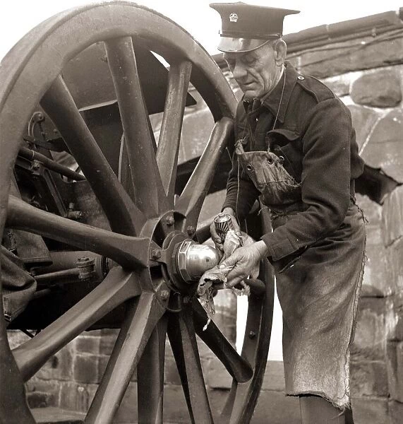 The Gunner getting the gun ready for firing, which is fired automatically by a nearby