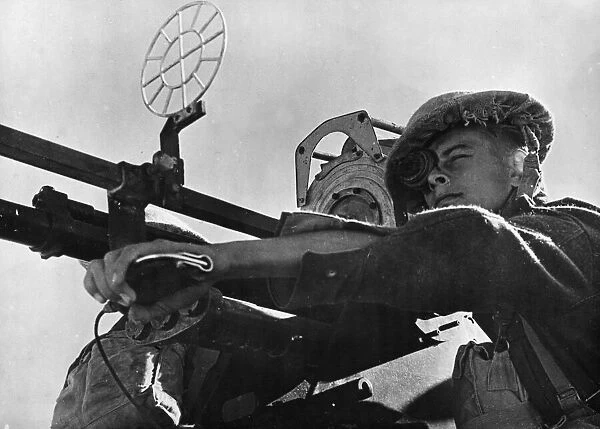 A gunner of an RAF Regiment Anti-Aircraft Flight mans a 20mm Hispano-Suiza anti-aircraft