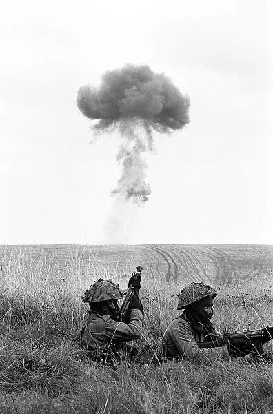 Gurkha Troops during a Nuclear Excercise - August 1962 take cover in long grass