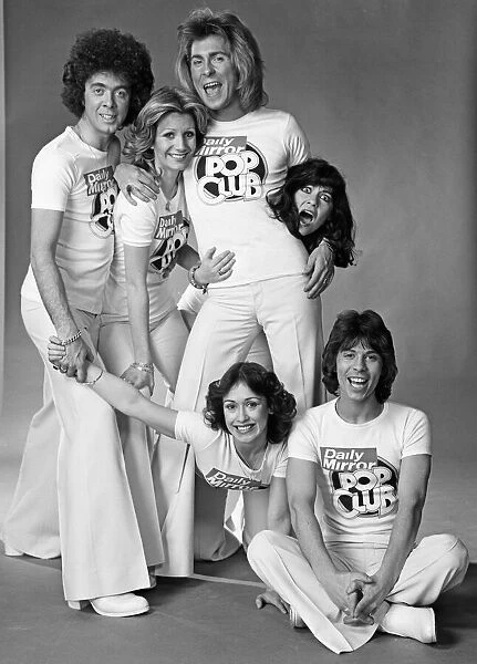 Guys N Dolls pop group wearing Daily Mirror Pop Club T-shirts 29th January 1976