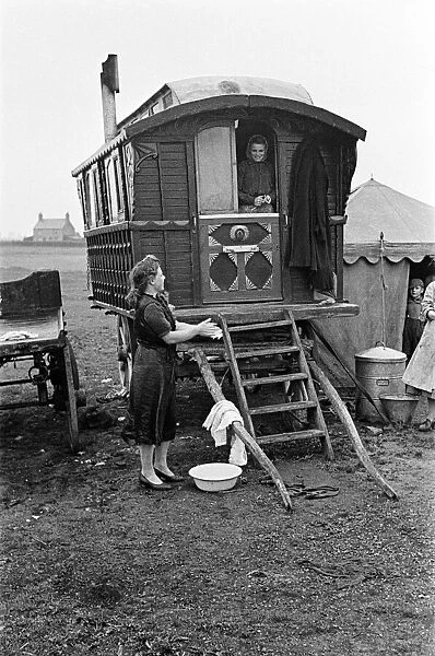 A Gypsy family outside their caravan. May 1947