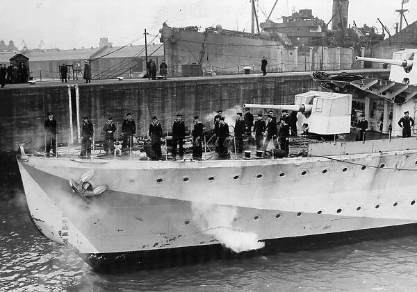 H. M. S. Hesperus enters a harbour, showing damage to her bows caused by ramming a German
