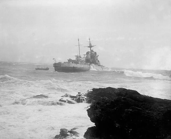 H. M.s Warspite on way to ship breakers yard is driven ashore by a gale at Mounts Bay