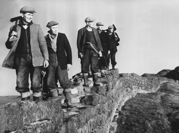 Framed Print : Hadrians Wall - workmen on restoration work pause foor a break as they walk along