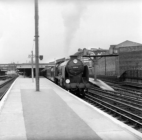 The Hailey Bury express steam train pulls in to Hastings station. May 1957 A380a