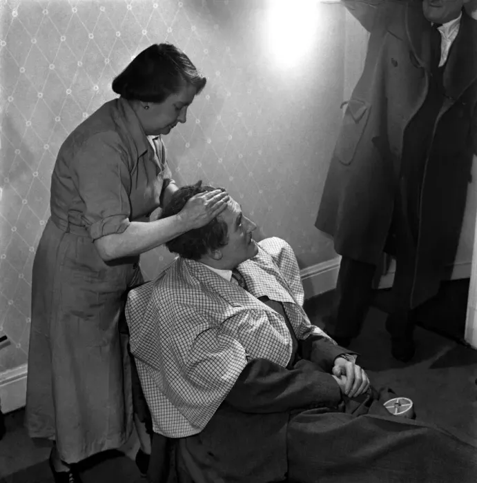 Framed Print : Hair restoration expert seen here giving a consultation. D7584-001 Framed Print : Hair restoration expert seen here giving a consultation. D7584-001