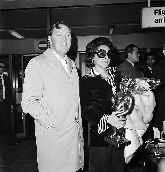 Bill Haley and his wife Martha arrive at Heathrow Airport. 15th May 1974